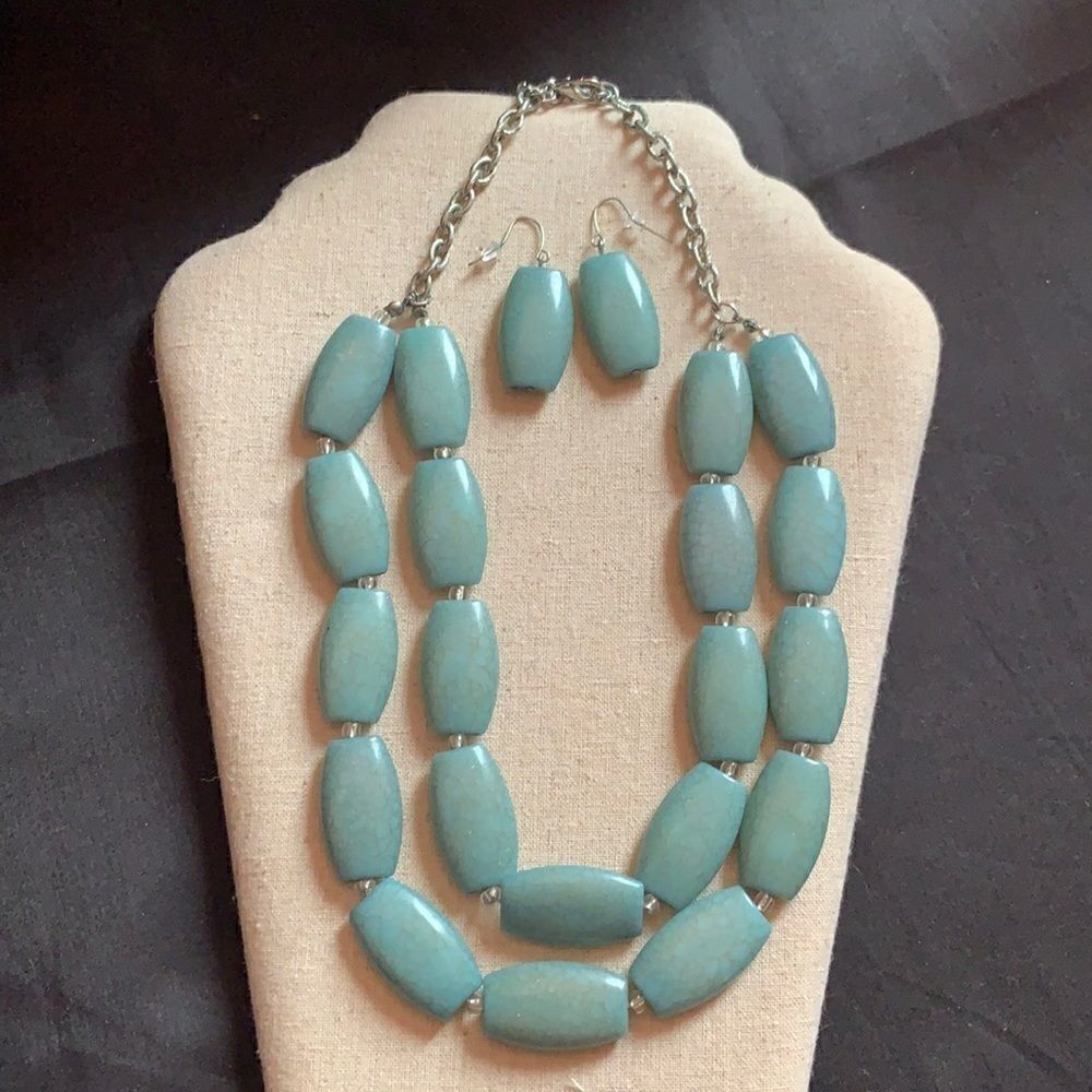 Silver and blue stone necklace and earring set